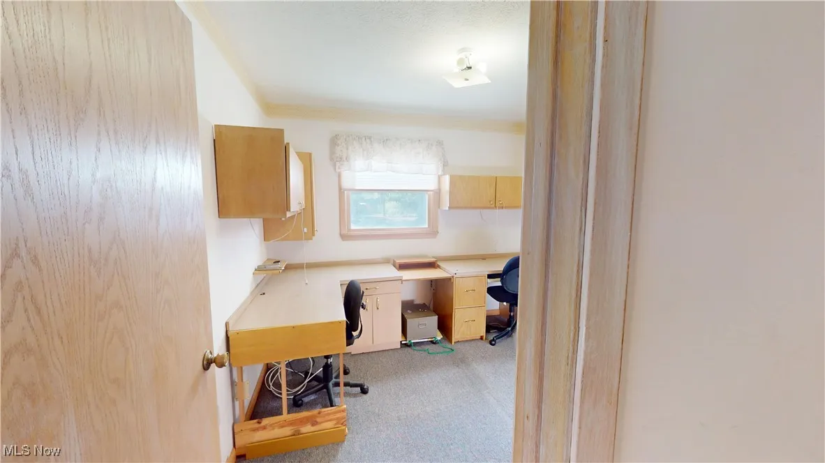 Bedroom #2 currently used as an office and built in desks.