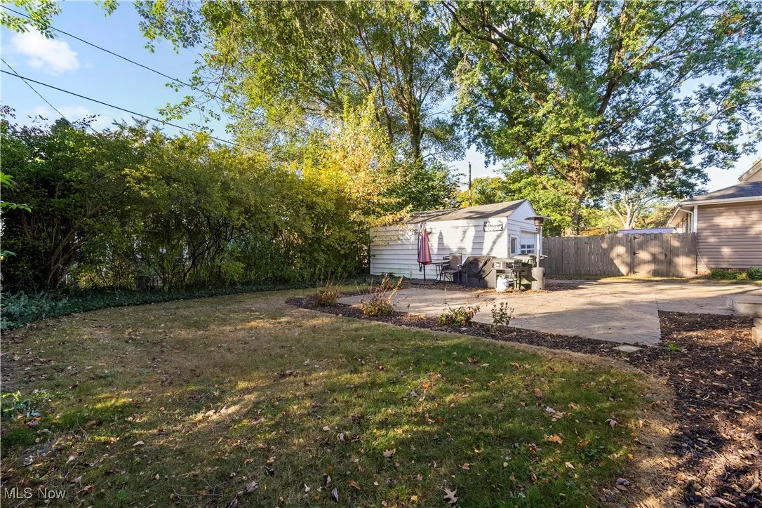 View of yard with a patio area and an outdoor structure