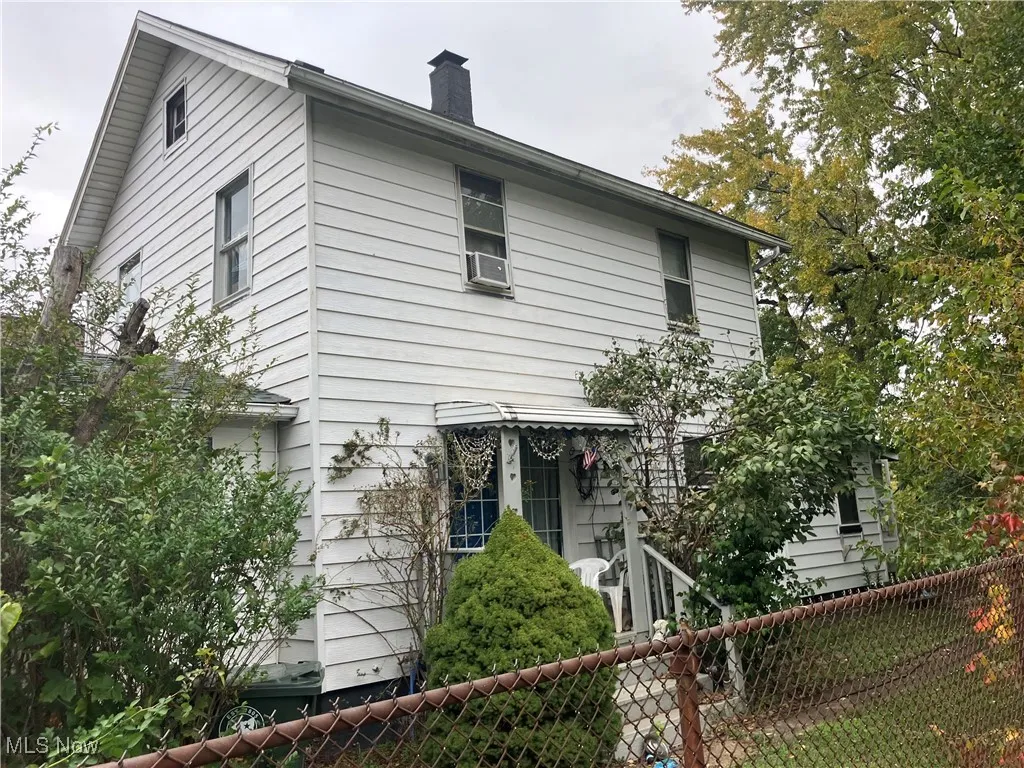 View of home's exterior featuring a chimney