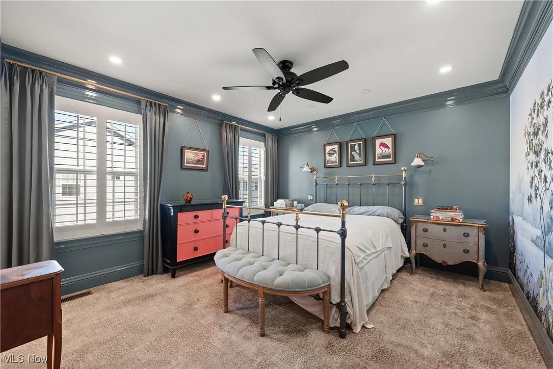 Carpeted bedroom featuring ornamental molding, a ceiling fan, and recessed lighting