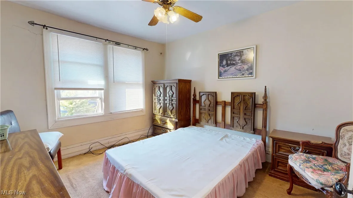 Bedroom featuring a ceiling fan
