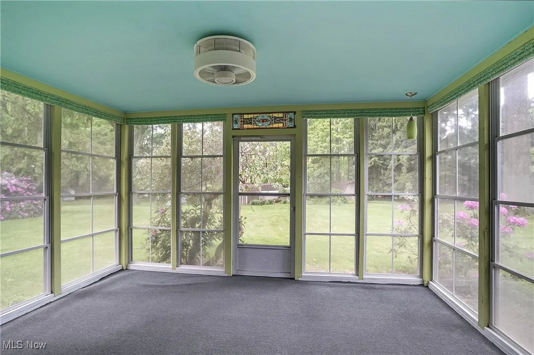 Charming Sun Room overlooking the private lot
