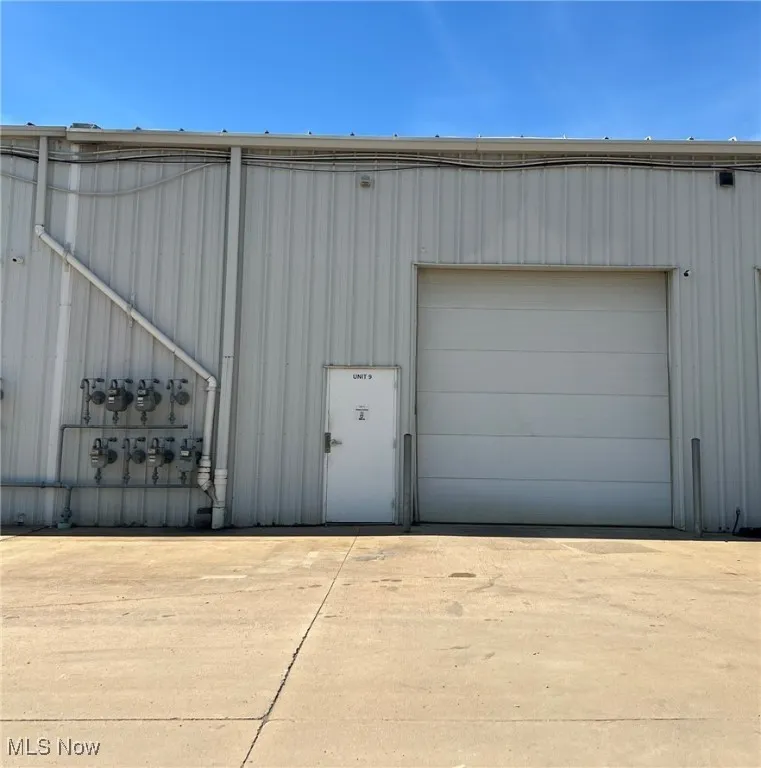 Garage featuring driveway