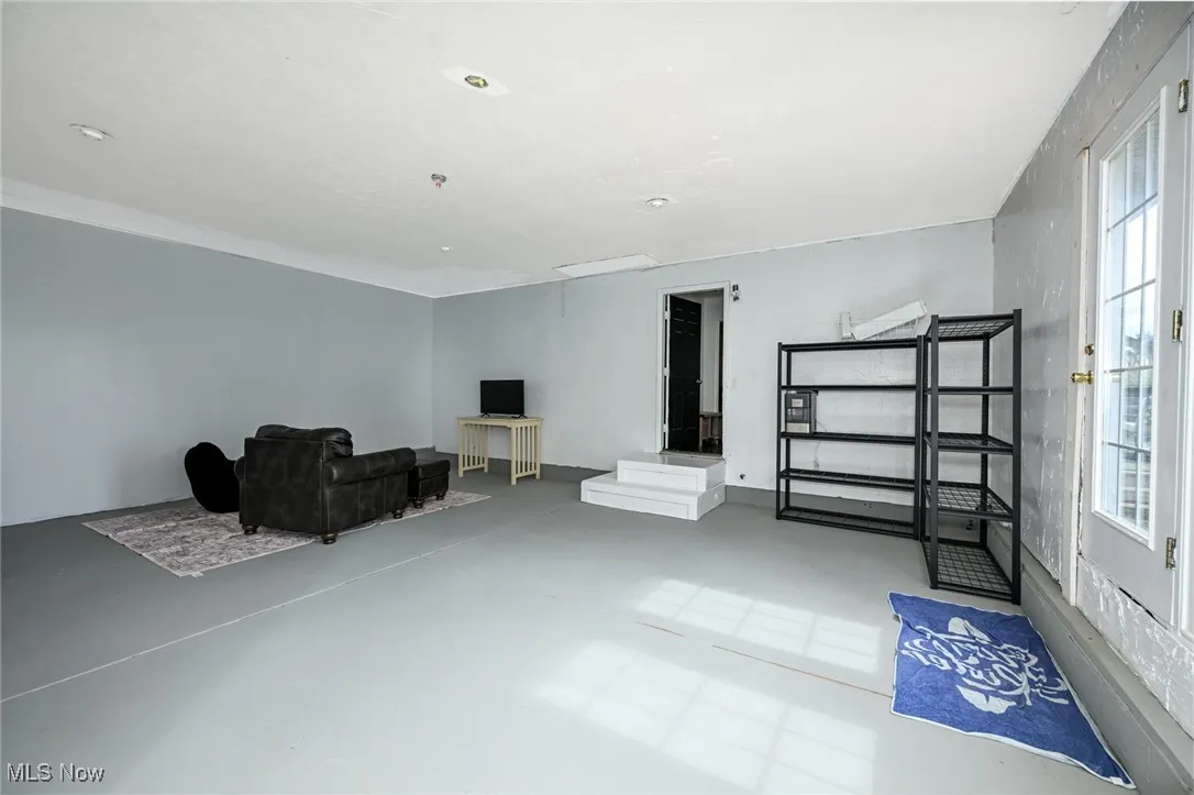 Living area featuring finished concrete flooring