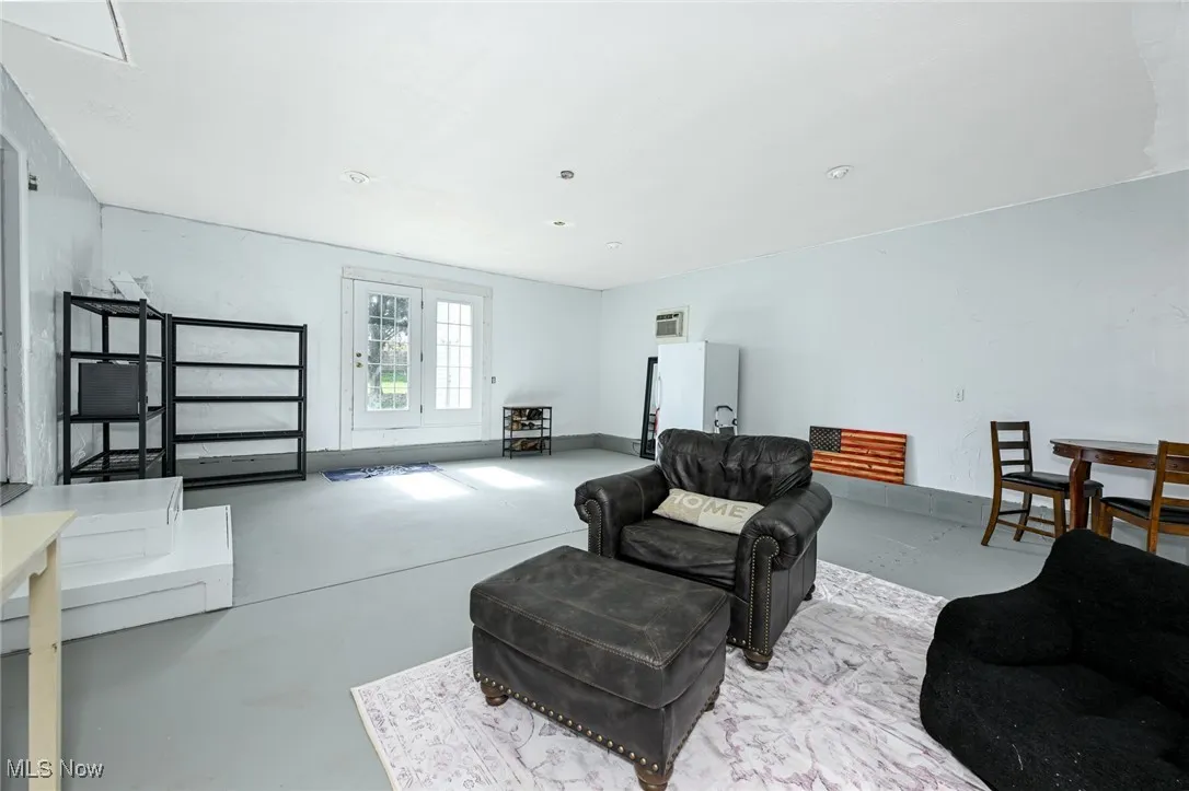 Living area featuring concrete flooring