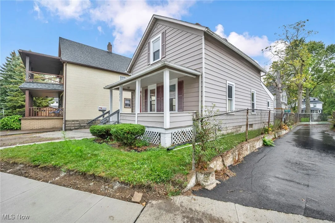 View of property exterior featuring a porch