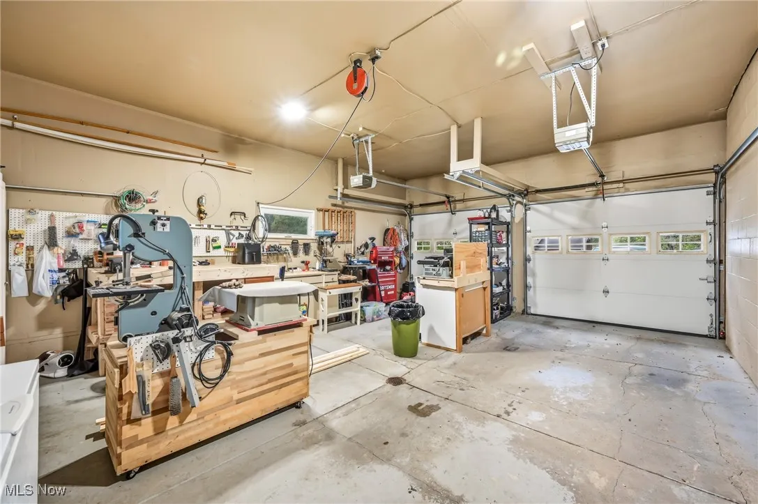 2 car garage, one side is currently being utilized as a workshop