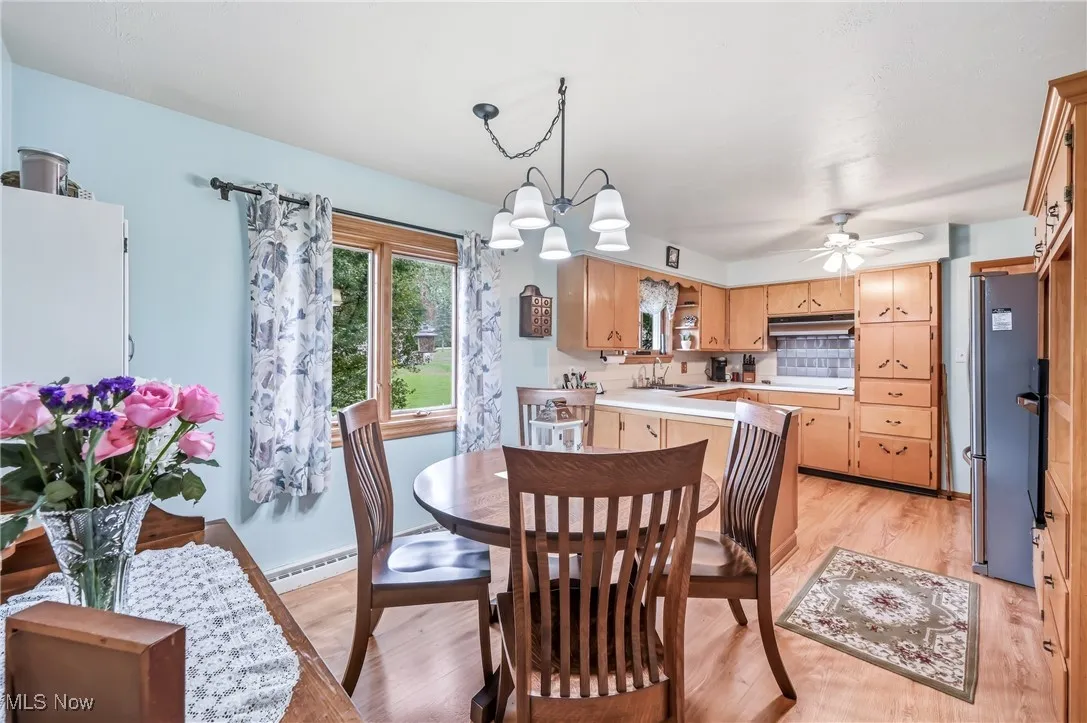 View from the dining area directly into the kitchen, highlighting the seamless flow between the eating and cooking spaces, perfect for entertaining.