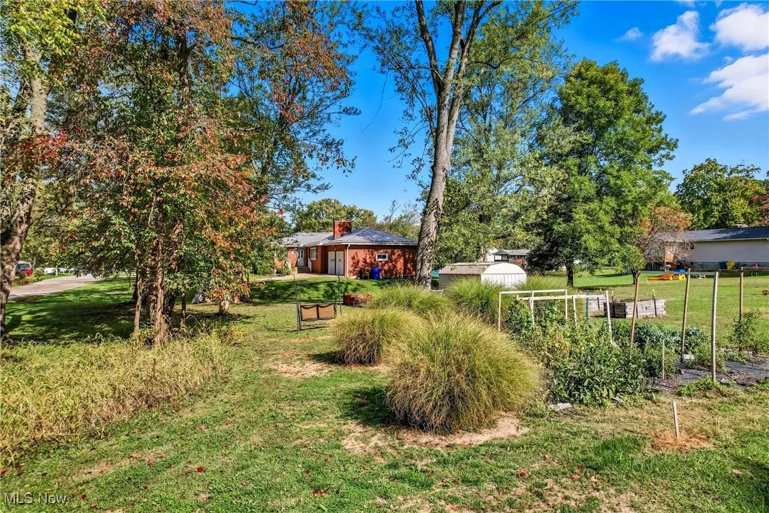generous setback and well-maintained front lawn with mature trees.