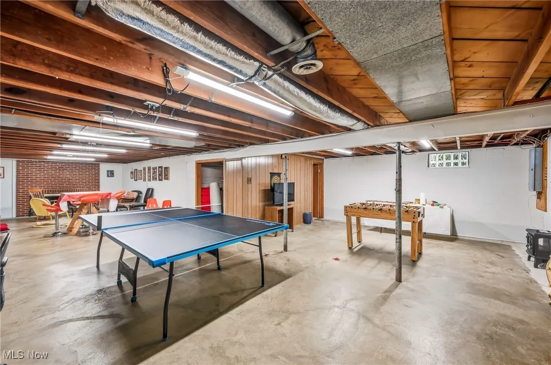 Partially finished basement w/ fireplace, ample gaming room & space