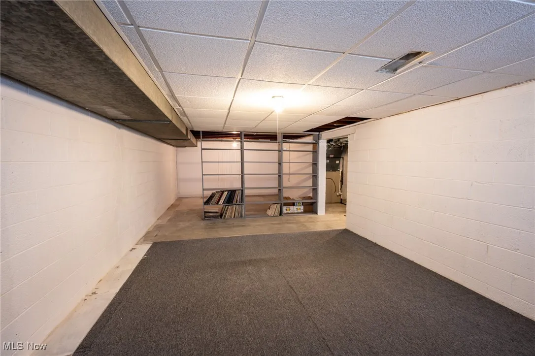 Finished below grade area with a paneled ceiling