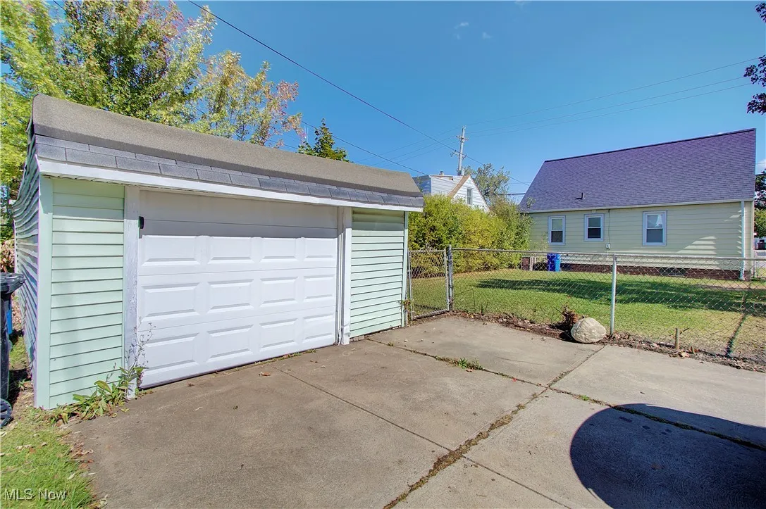 Detached garage with concrete driveway