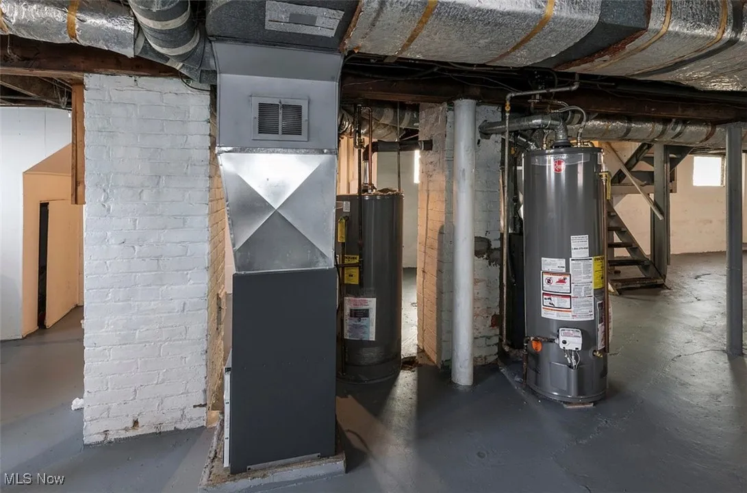 Utility room with water heater and heating unit