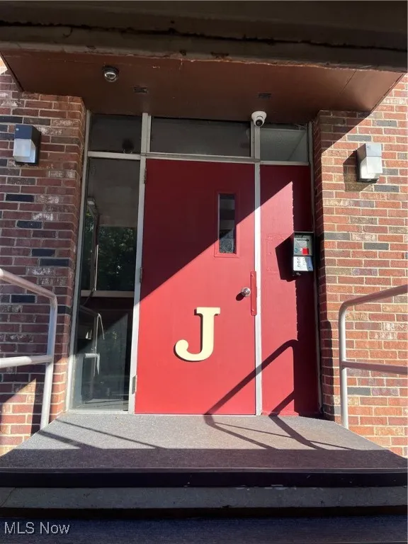 Property entrance with brick siding