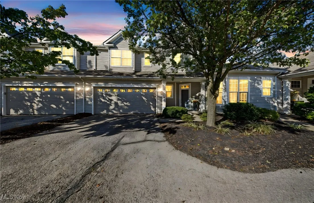 View of front of home featuring driveway and an attached garage