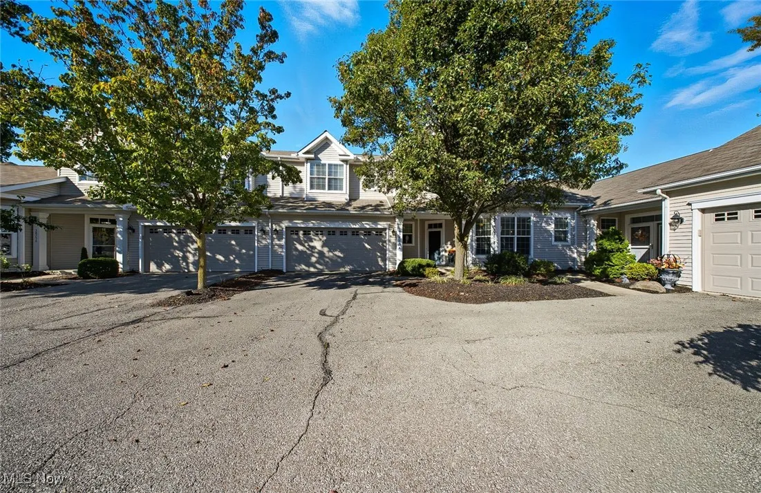 Obstructed view of property featuring driveway