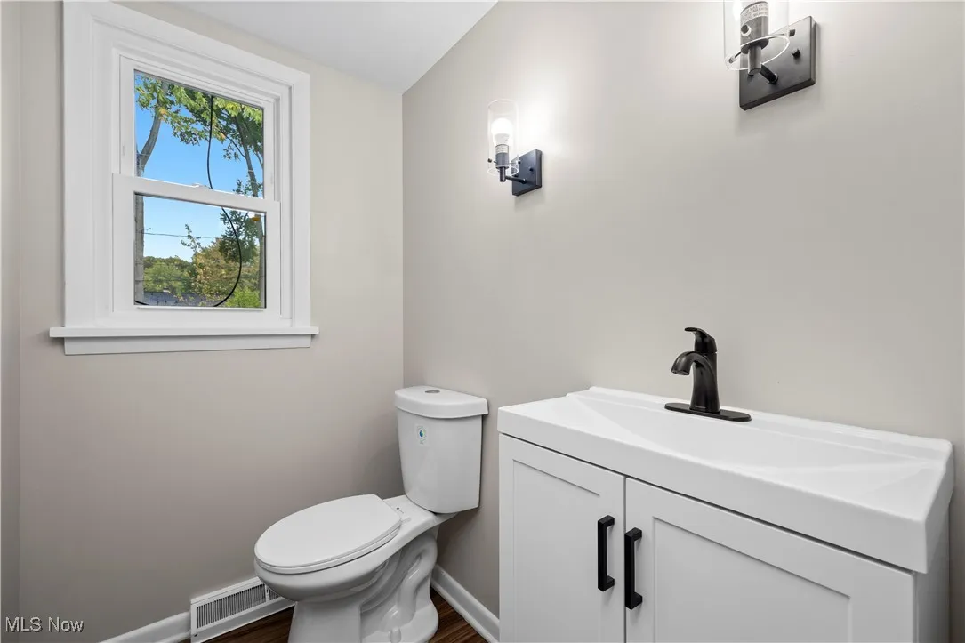 Bathroom with vanity and dark wood finished floors