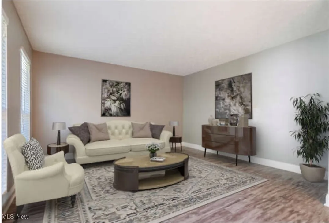 Living room with baseboards and wood finished floors