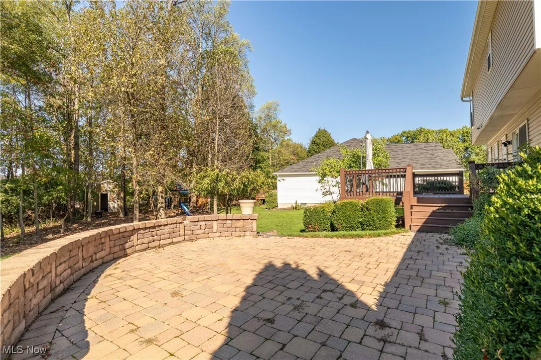 View of patio / terrace featuring a deck and a playground