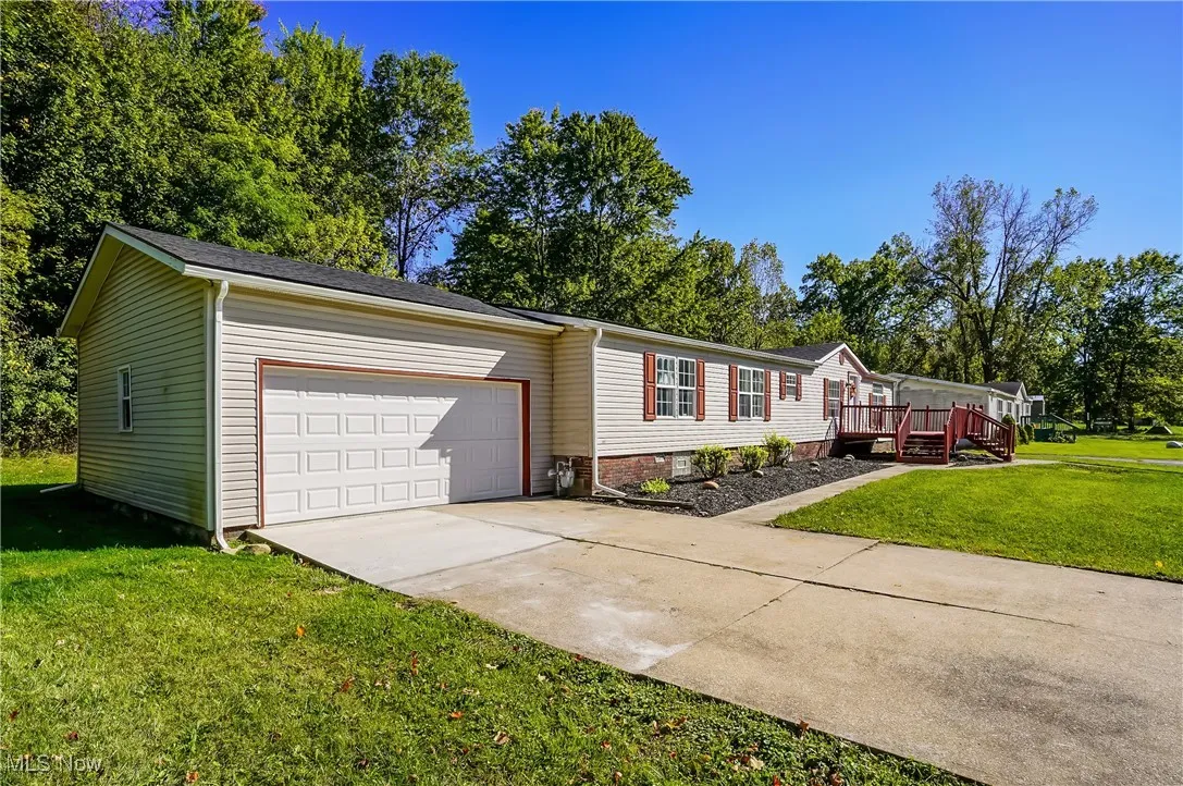 Extra large concrete driveway provides plenty of parking space.