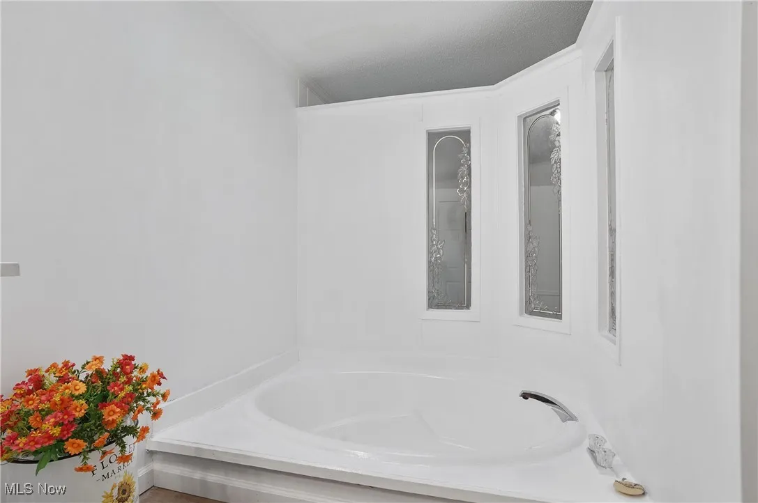 Relax in soaking tub in primary bathroom.