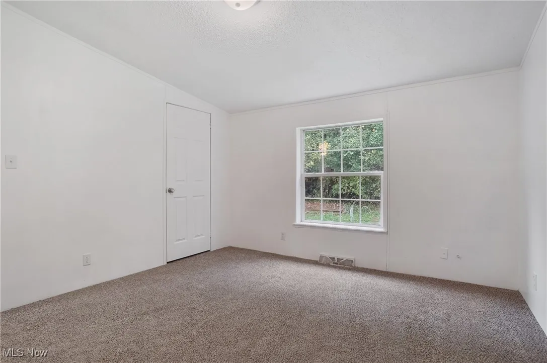 Bedroom two new 2025 paint and lighting. New 2024 carpet.