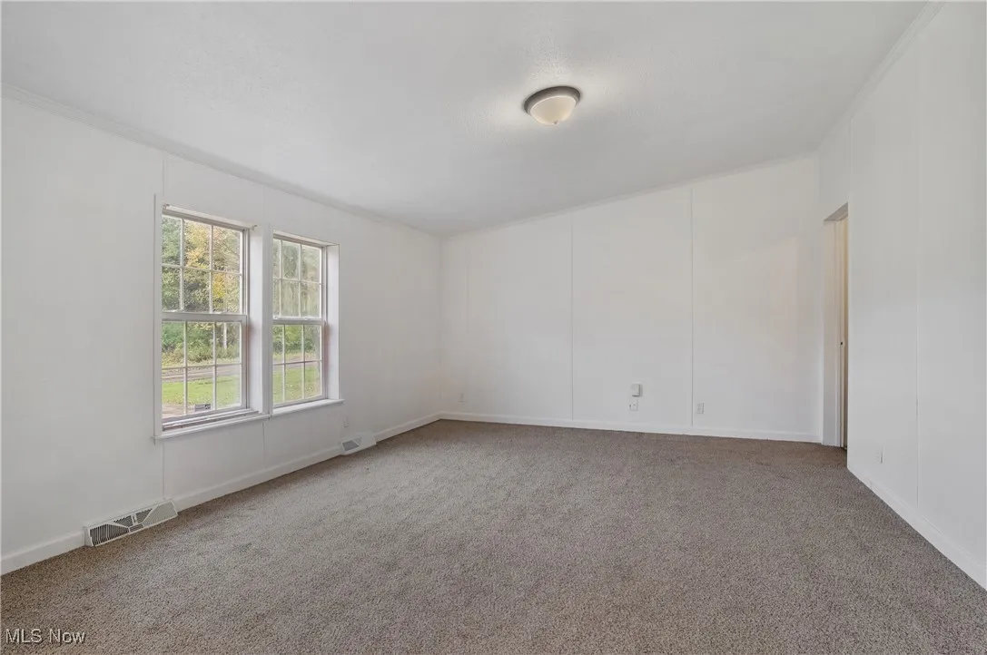 Family room features new paint, lighting, and blinds 2025. New carpet 2024.