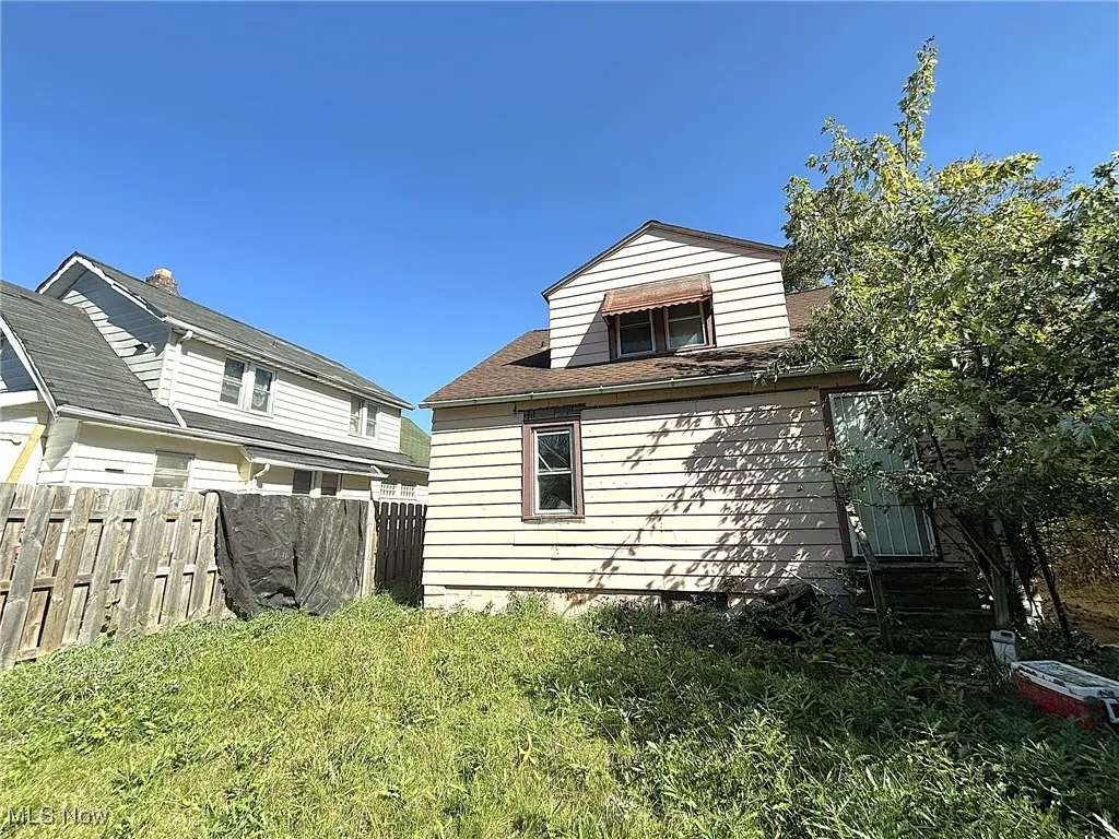 View of property exterior featuring roof with shingles