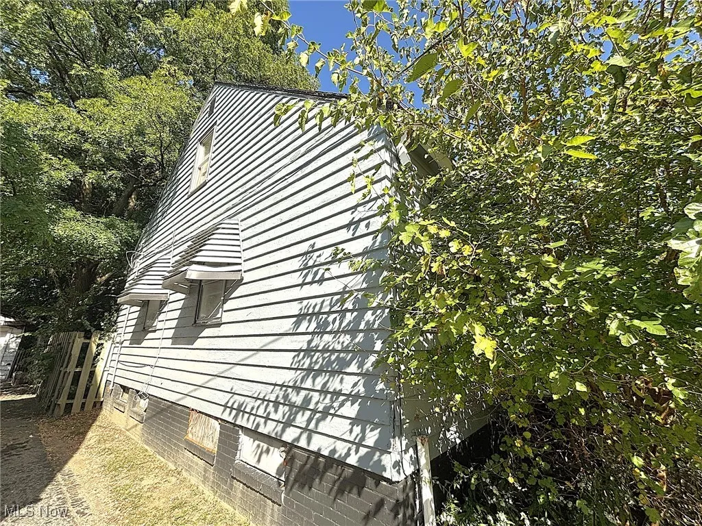 View of property exterior featuring crawl space