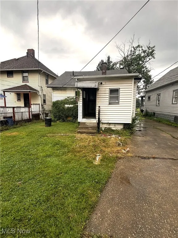 View of front of property featuring a chimney