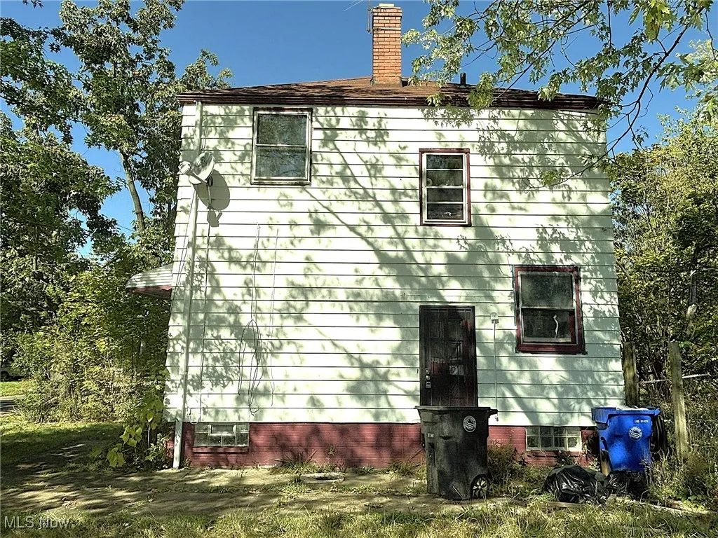 View of home's exterior featuring a chimney