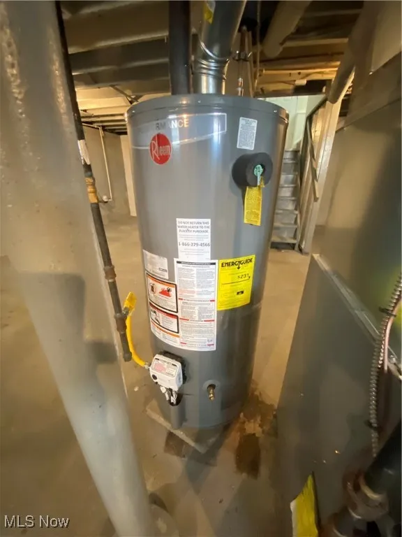 Utility room featuring gas water heater