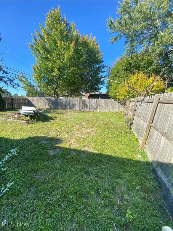 View of fenced backyard