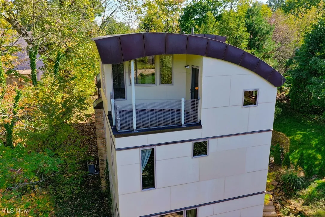 View of home's exterior featuring a balcony