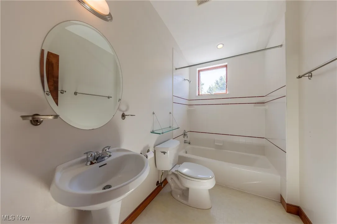 3rd floor Full bath featuring shower / bathtub combination and toilet