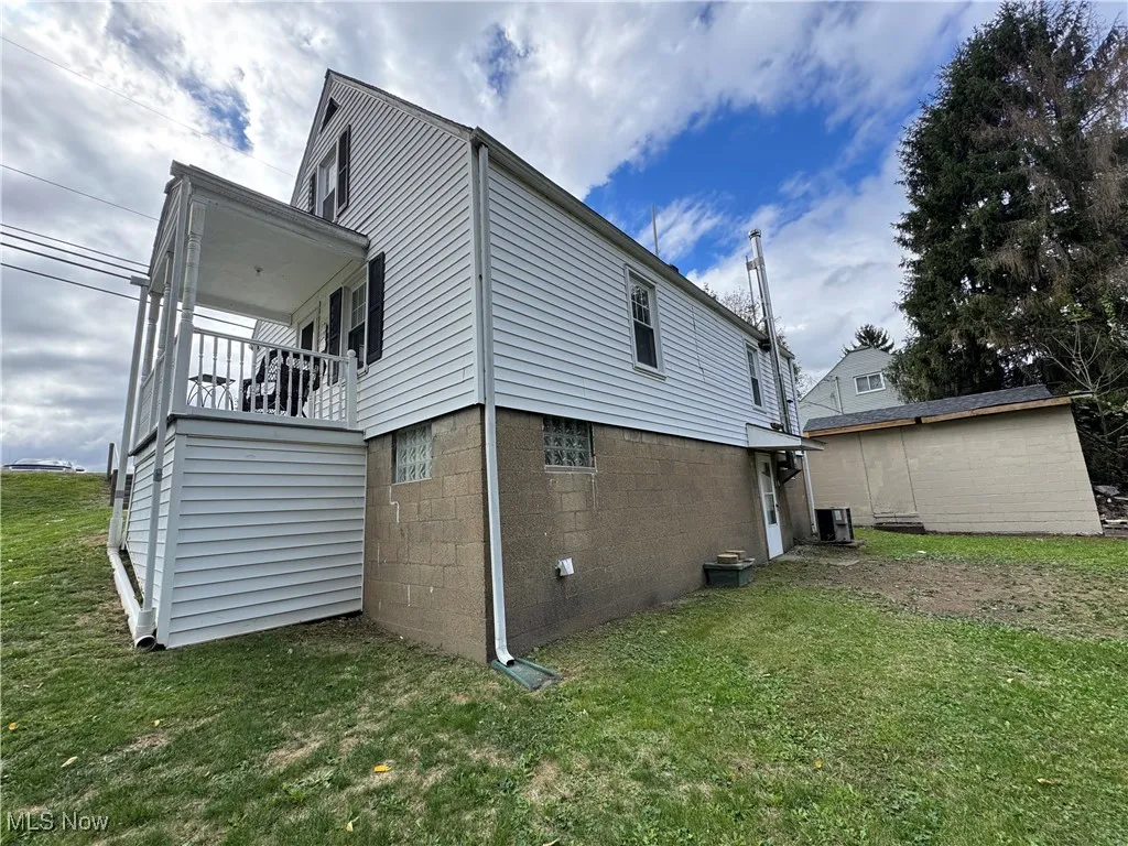 View of home's exterior featuring a lawn