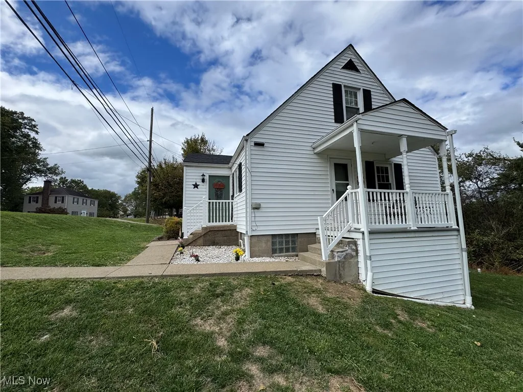 Bungalow-style house with a front yard