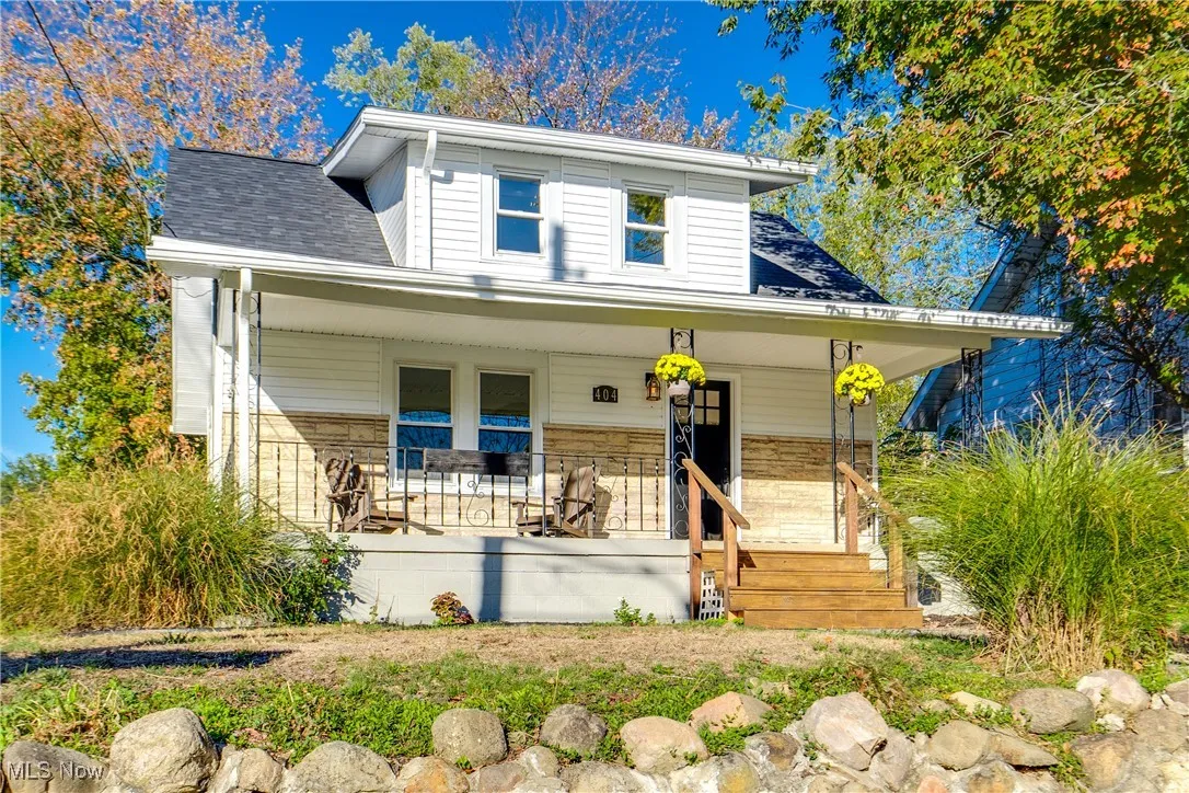 Bungalow-style home with a porch and a shingled roof
