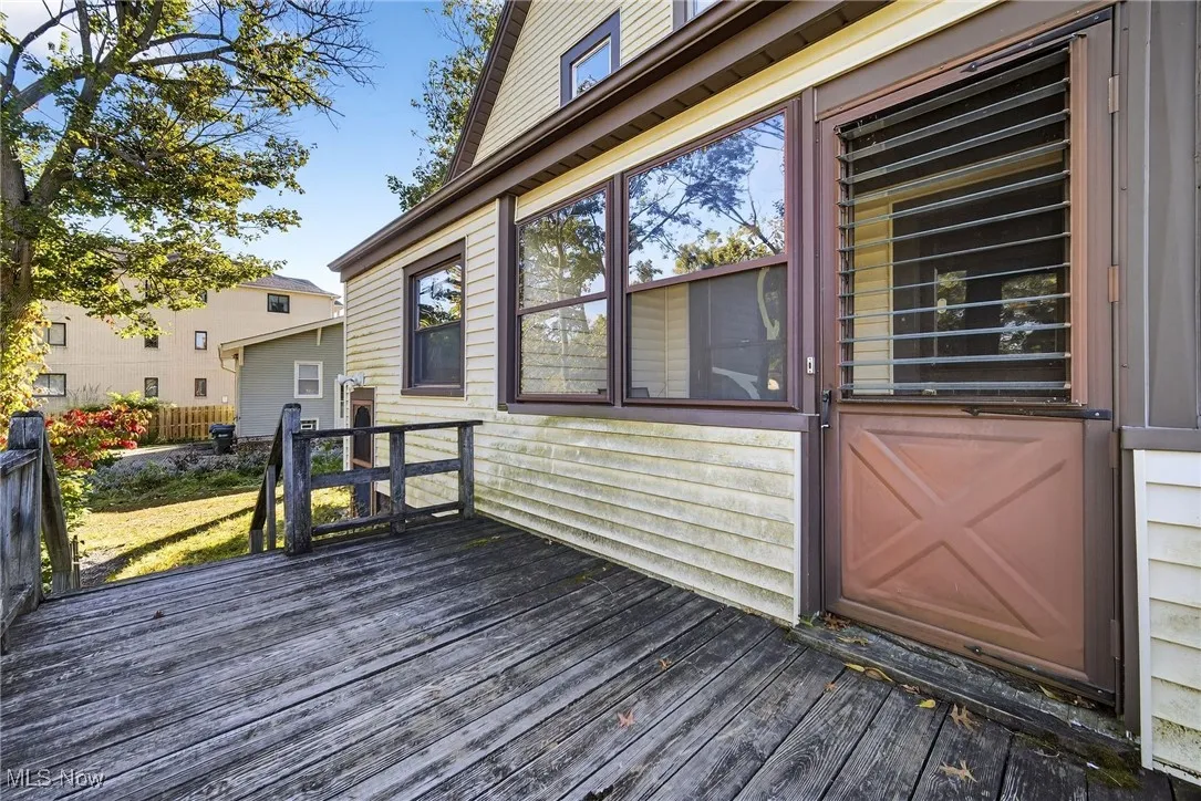 Deck featuring a sunroom