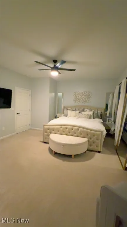 Bedroom featuring carpet and ceiling fan