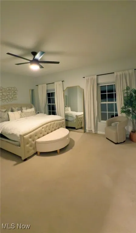 Bedroom featuring carpet flooring and a ceiling fan