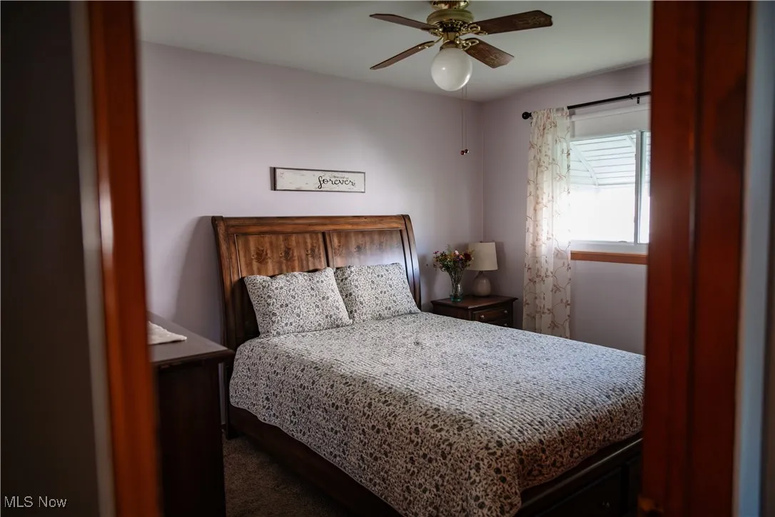 Bedroom featuring a ceiling fan