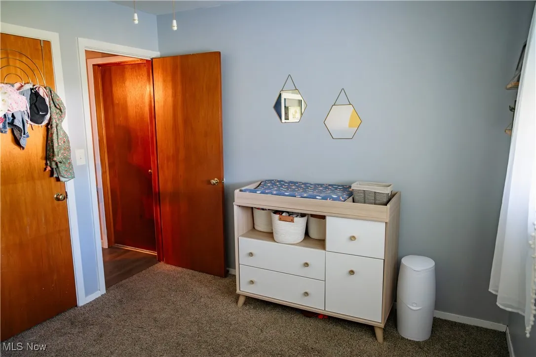 Bedroom with carpet and baseboards