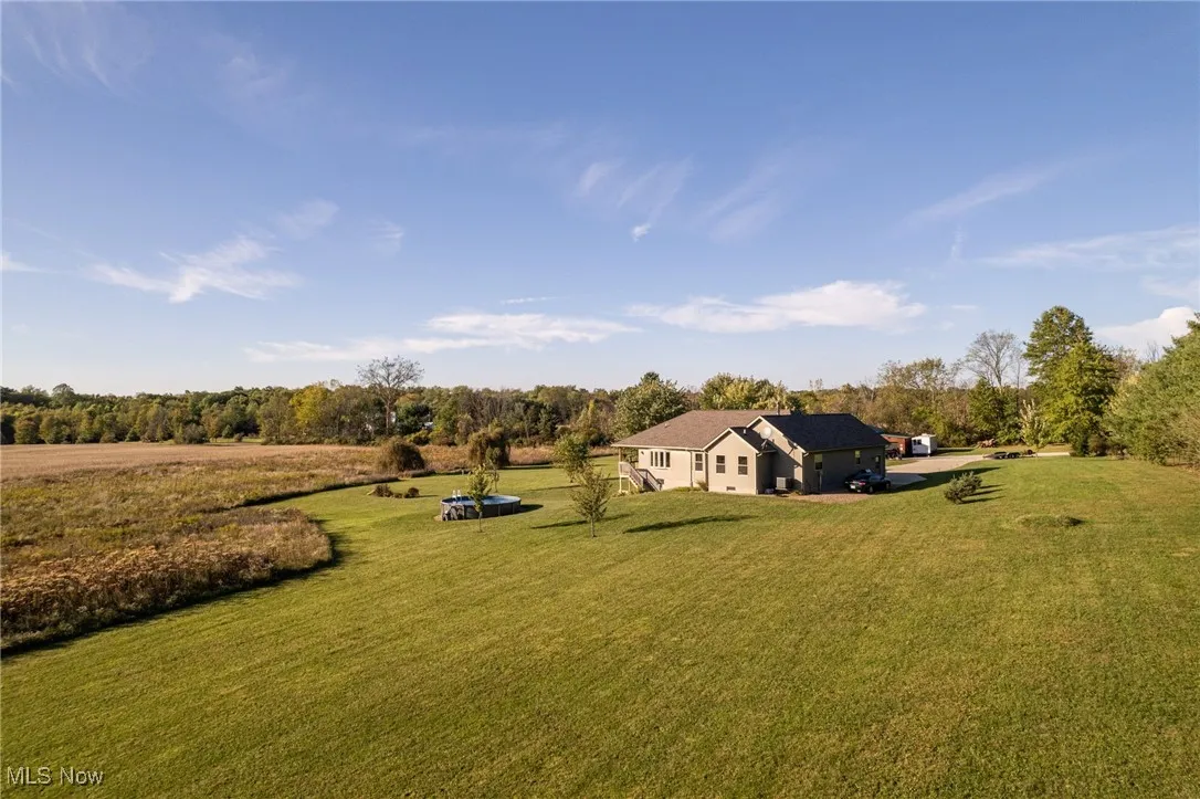 View of grassy yard with a view of countryside