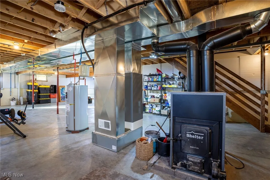 Utility room with water heater and heating unit