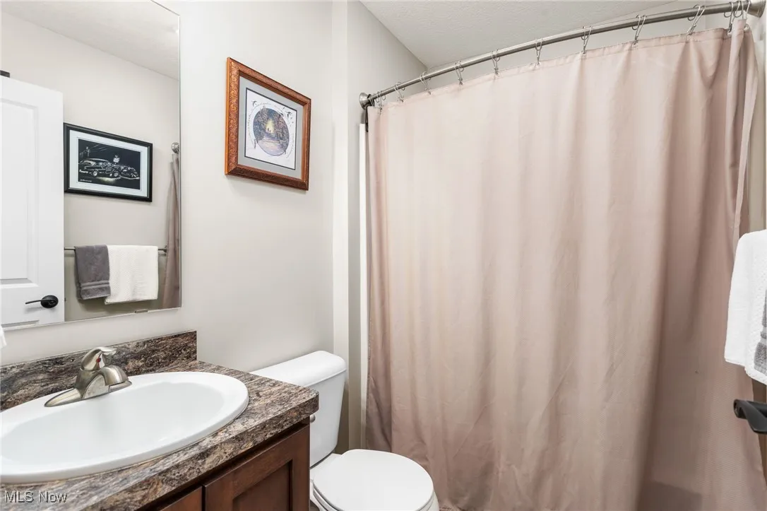 Bathroom with vanity and a shower with curtain