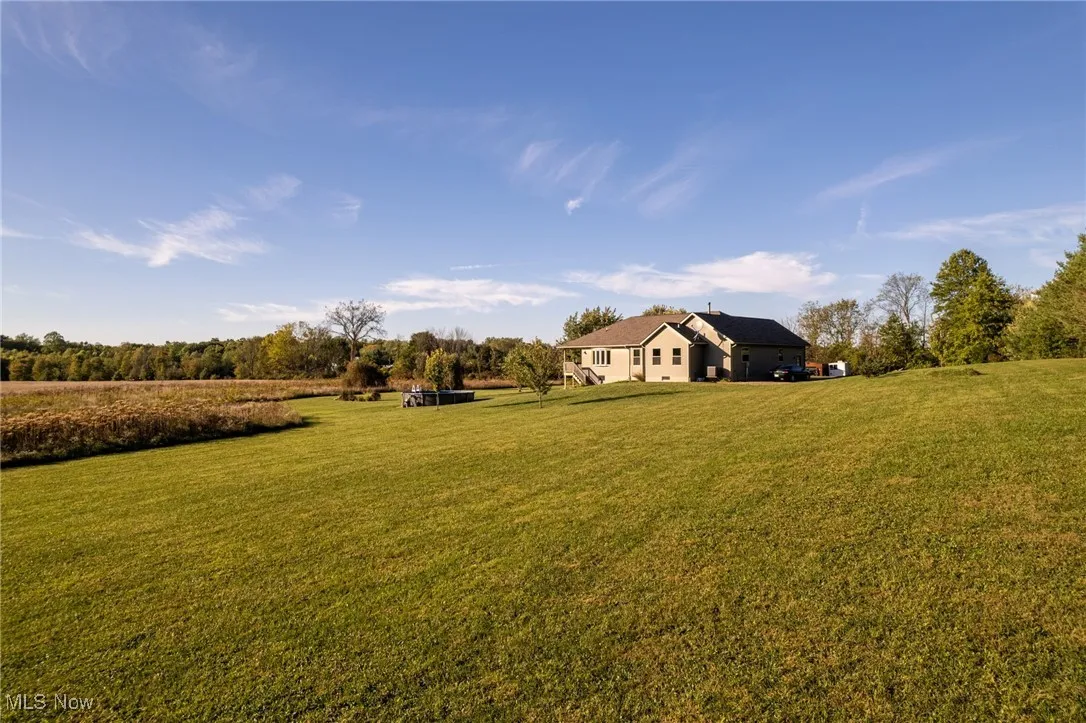 View of grassy yard featuring a view of rural / pastoral area