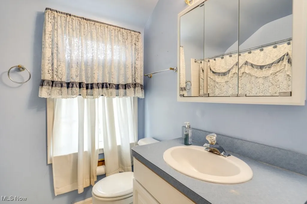 Full bath featuring vanity