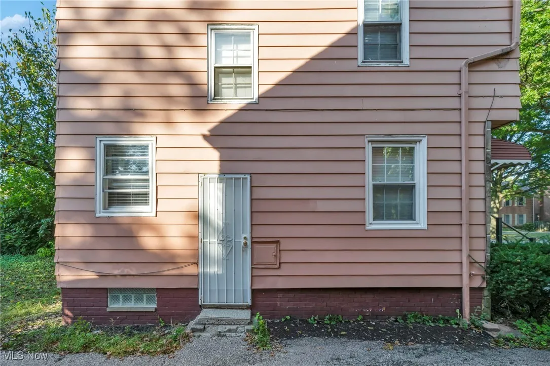 View of property exterior with crawl space