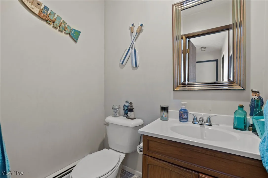Bathroom featuring vanity and a baseboard radiator